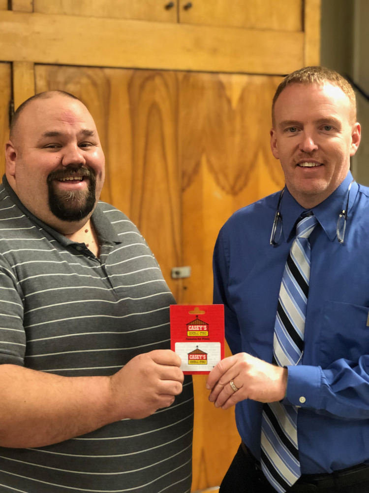Mr. Garrard presenting Mr. Somodi a Casey's Gift Card