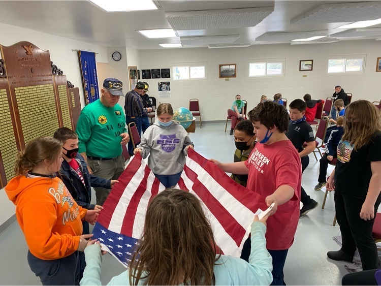 5th Grade Veterans Day field trip - learning how to fold the flag